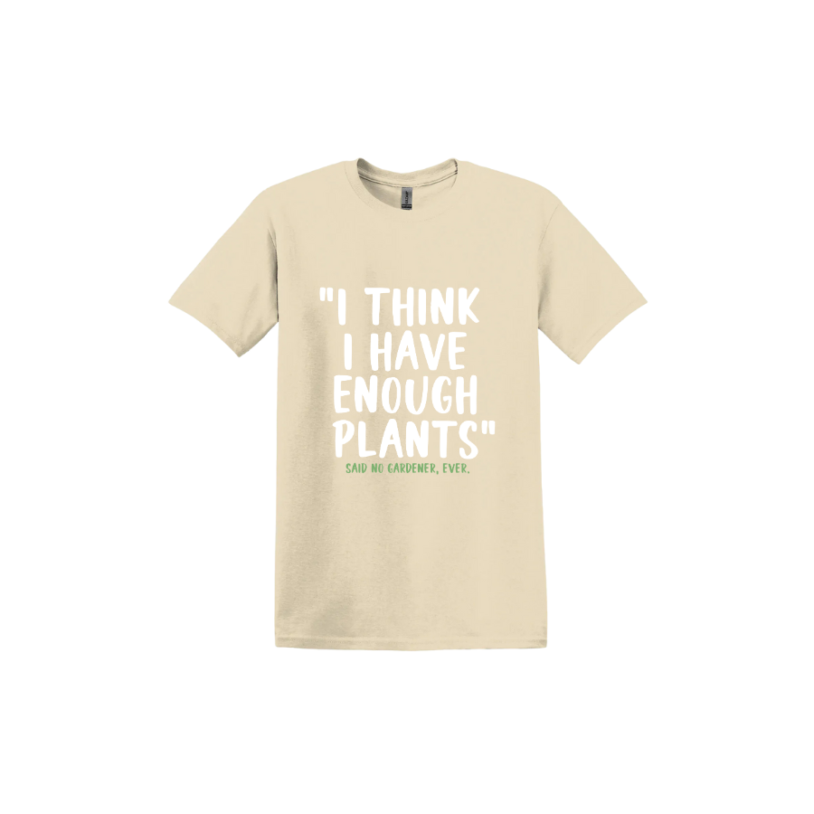 Sand unisex tshirt featuring large white text that reads 'I think I have enough plants" and smaller green text underneath that says 'Said no gardener, ever.'.