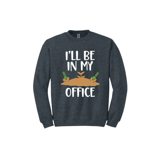 Dark heather unisex sweatshirt with text reading 'I'll be in my office' alongside a graphic of dirt with two green shovels.