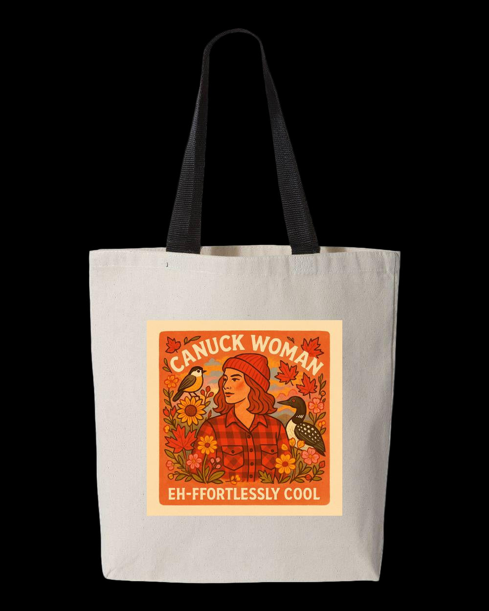 White tote bag with a graphic of a woman in a red toque and plaid shirt, surrounded by leaves and birds, with the words "Canuck Woman" and "Eh-ffortlessly Cool"