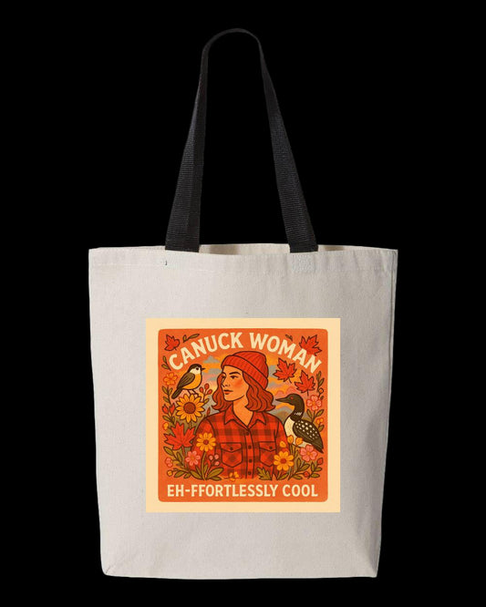 White tote bag with a graphic of a woman in a red toque and plaid shirt, surrounded by leaves and birds, with the words "Canuck Woman" and "Eh-ffortlessly Cool"