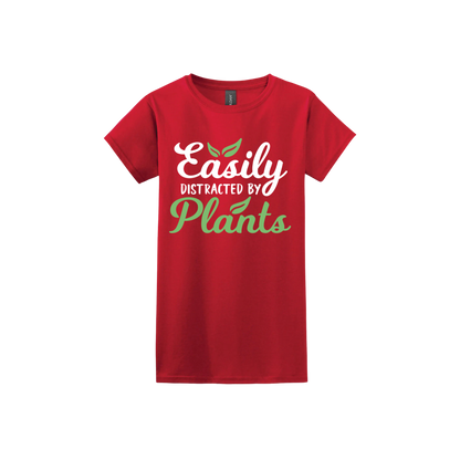 Red womens tshirt with text reading 'Easily Distracted By Plants'.
