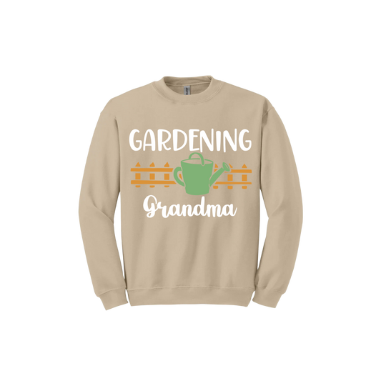 Sand unisex sweatshirt with white text reading 'Gardening Grandma' with graphics of a picket fence and a green watering can.