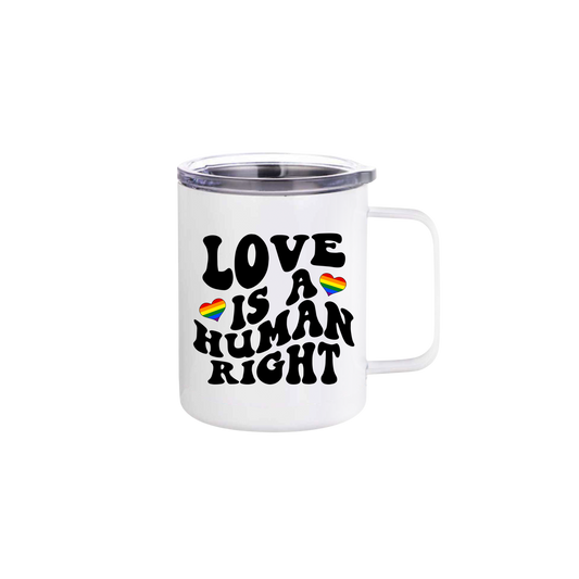 A white stainless steel mug with text that reads 'Love is a human right' along with graphics of rainbow colored hearts.