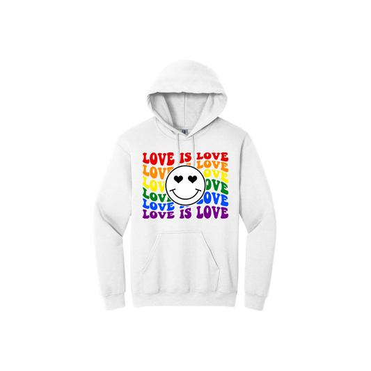 White unisex hoodie with rainbow text reading 'Love is Love' along with a graphic of a smiley face with heart eyes in the center.