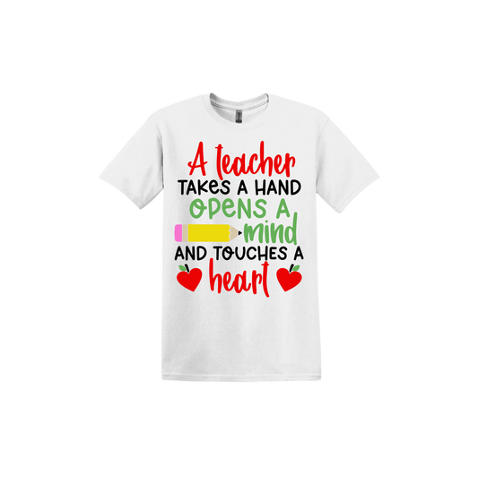 White unisex tshirt with colorful text reading "A teacher takes a hand opens a mind and touches a heart". The design features a pencil and two apples in the shape of hearts.