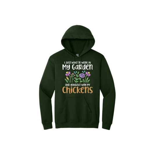 Green unisex hoodie with text that reads 'I just want to work in my garden and hangout with my chickens' with graphics of flowers in the center.