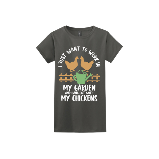 Charcoal womens tshirt with text that reads 'I just want to work in my garden and hangout with my chickens' with graphics of two chickens above a picket fence and a green watering can.